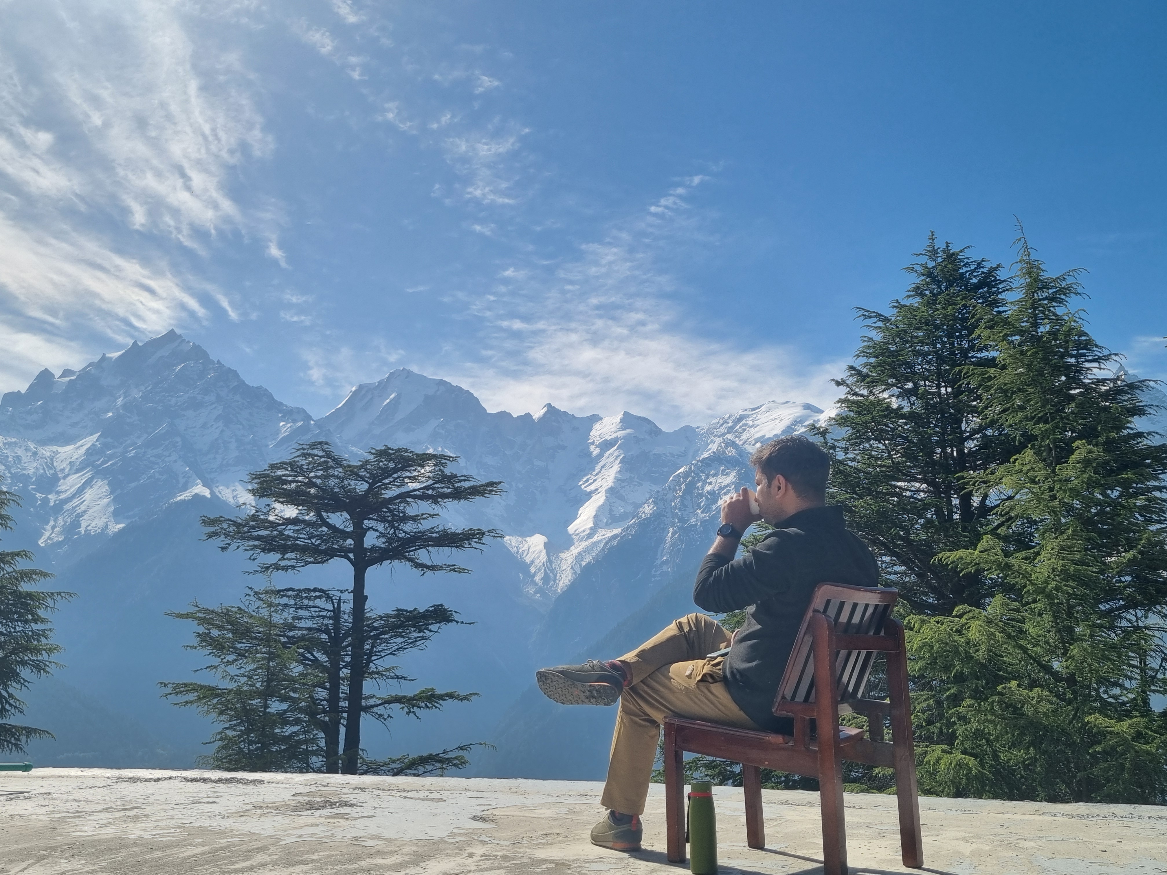 Drinking tea with the mountains as a backdrop